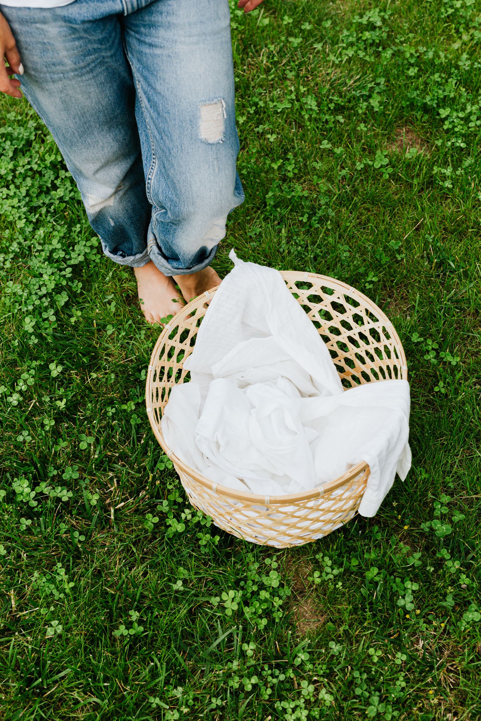 Fresh folded linens in a woven basket